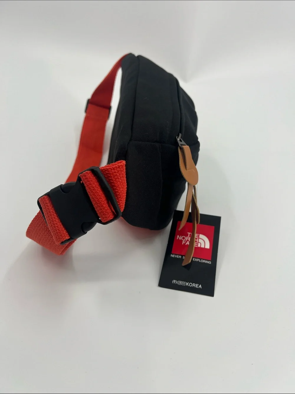 The North Face Black Belt Bag with Red Strap for Men & Women